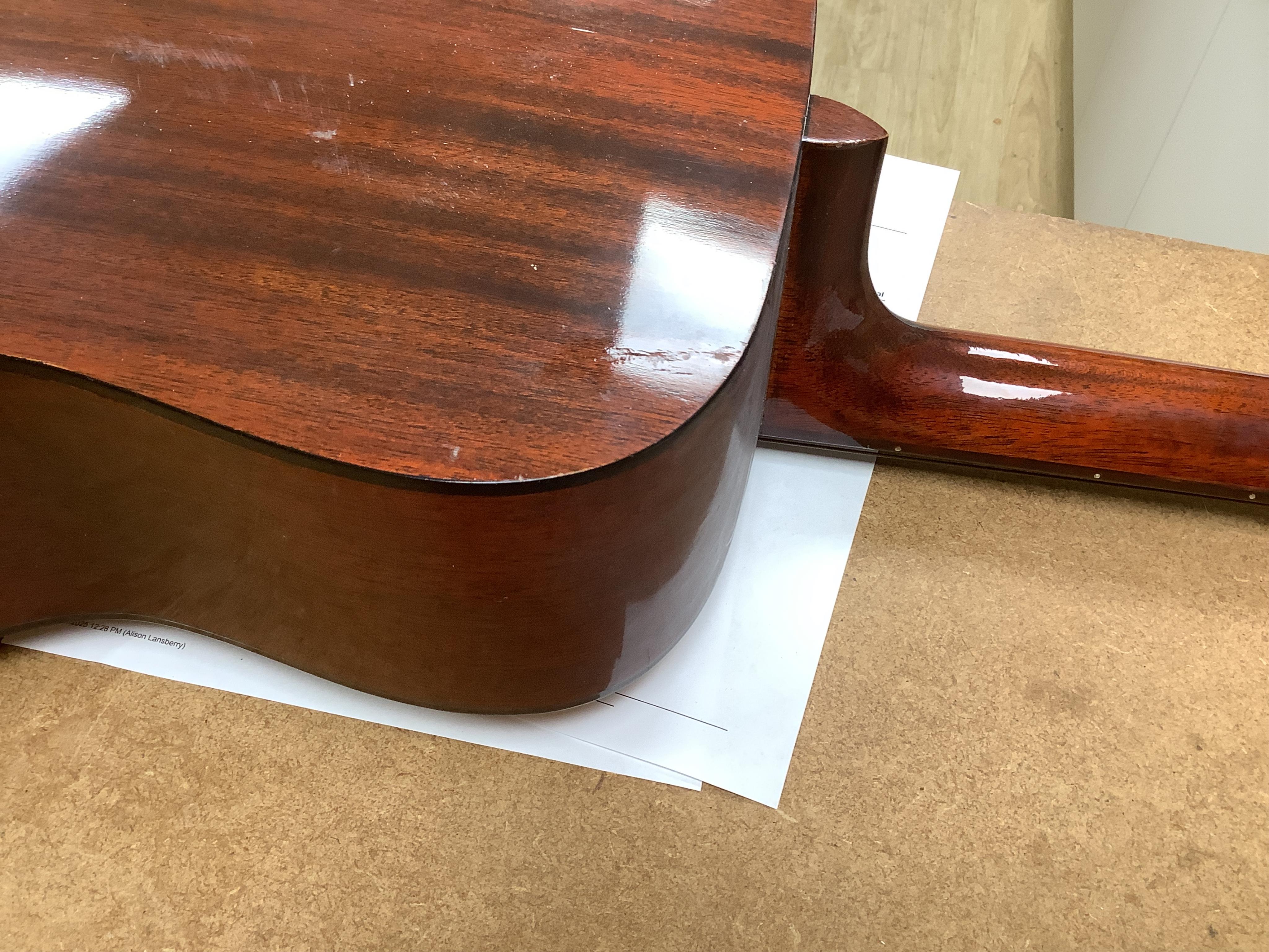 A Yamaha FG-180 acoustic steel string guitar